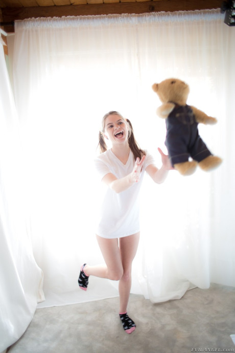 Fresh young sweetie Alice March shows off her bitty parts in socks with Teddy in hand