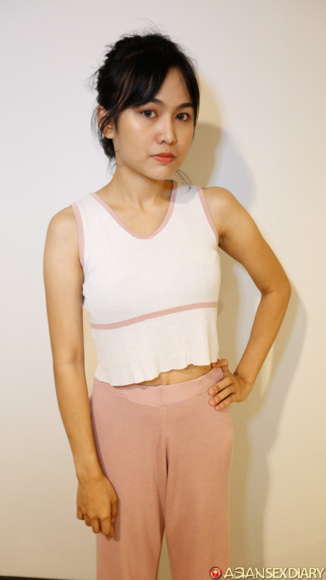 Ravishing fine oriental babe Aye shows her sweet tasty titties before having POV sex