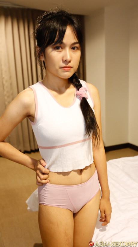 Ravishing fine oriental babe Aye shows her sweet tasty titties before having POV sex