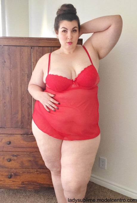 Fatty in a red negligee whore woman Sublime flaunts her large juggs while sucking a toy