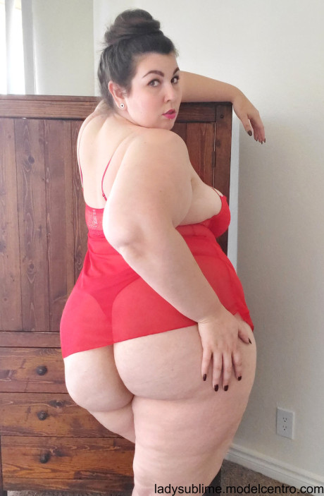 Fatty in a red negligee whore woman Sublime flaunts her large juggs while sucking a toy