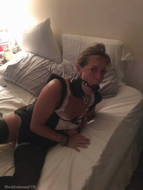 Busty lady finds herself bound and gagged in varying ways around her home