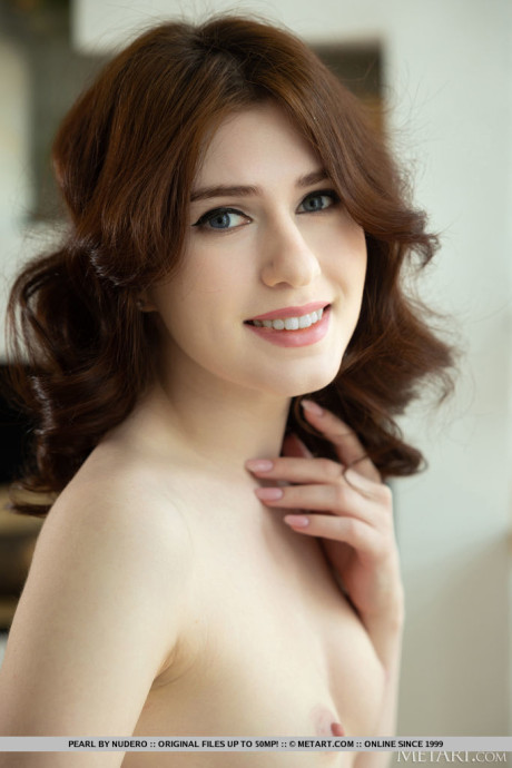 Attractive teen Pearl discards a red dress to model in the buff