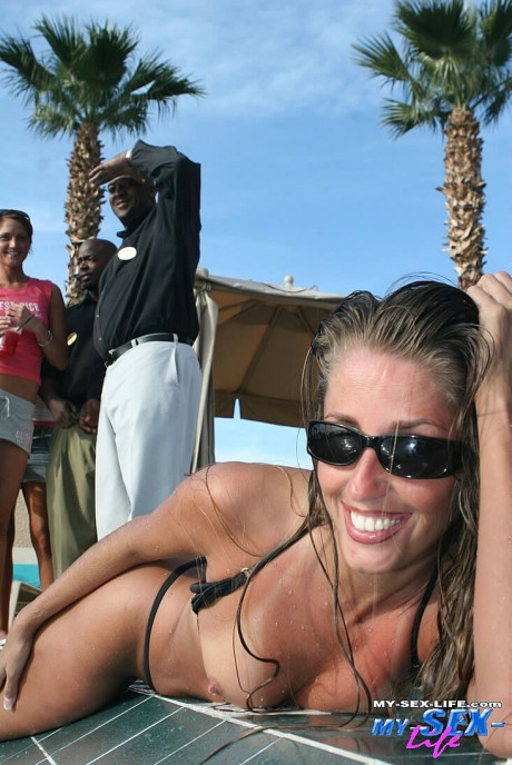 Horny mom in sunglasses Lori Anderson flaunts her small boobs & behind in the pool