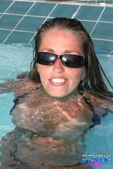 Horny mom in sunglasses Lori Anderson flaunts her small boobs & behind in the pool