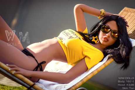 Brunette sex doll Elsa hosing down her wonderful large tits while sunbathing