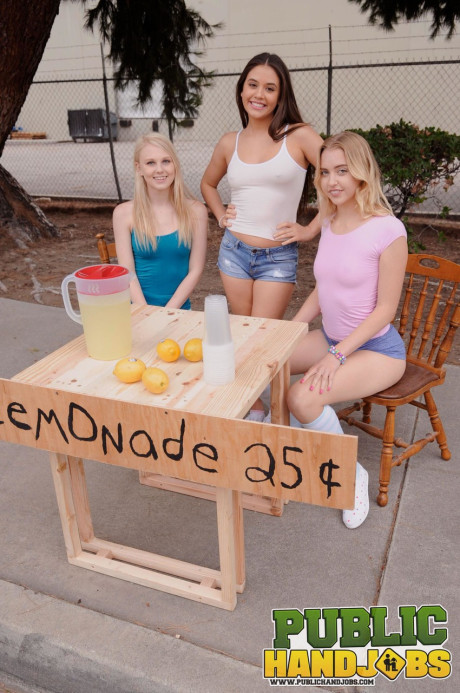 Sleazy schoolgirls give their lemonande customer a handjob in public