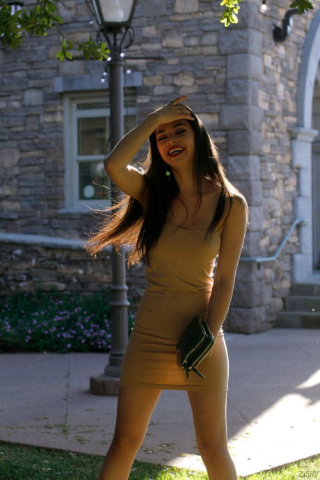 Thin babe Scarlett Alexis shows her hot legs wearing a sexy dress