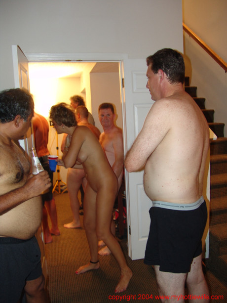 Horny swinger wives share their pussies with mature guys at a group sex party