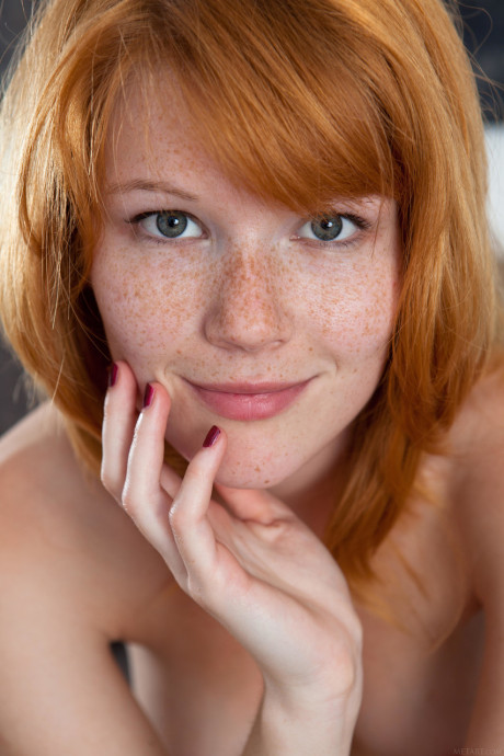 Czech teen Mia Sollis displays her pretty freckled face & bald snatch up close