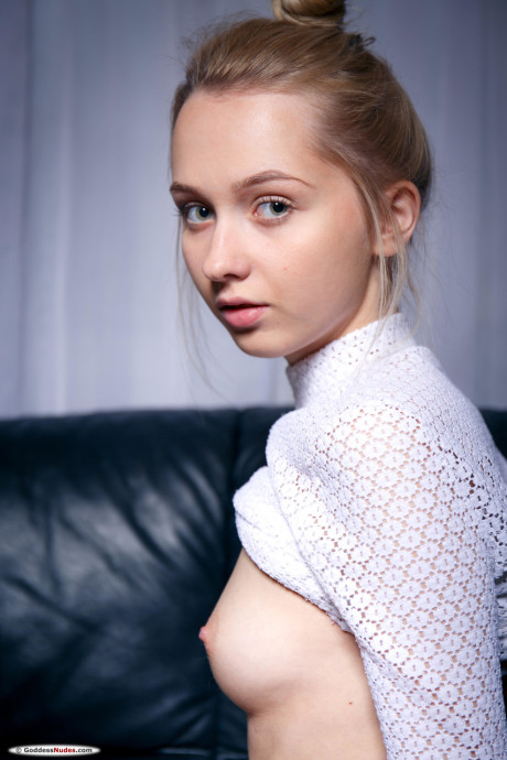 Pretty skinny teenie Bernie unveils her lovely muff & adorable titties on a couch