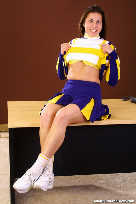 Pretty cheerleader Sally Lesters toys her wet trimmed pussy up close
