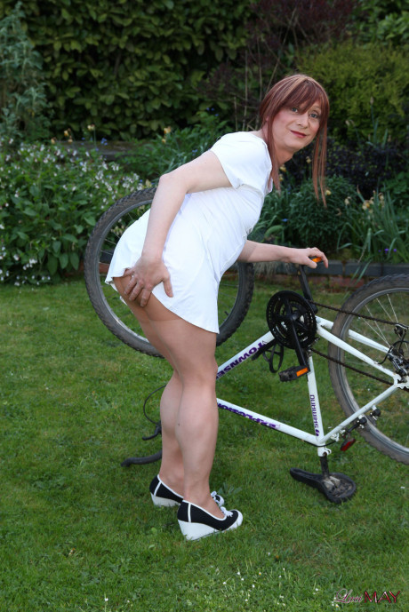 Fine Lucimay gets very soapy as she cleans her bike