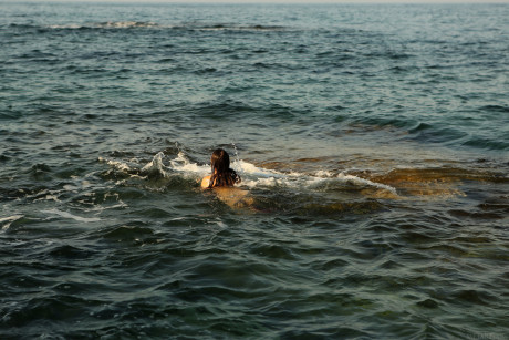 Pretty teenie Danniela shows her sweet tasty boobs & flaunts her hairy pussy in the sea