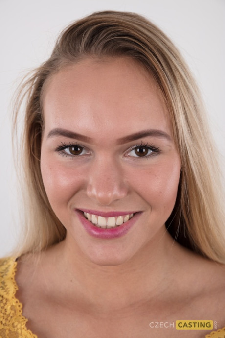 Fully clothed 18 year cougar Silvie stands behind undressed after removing her clothes