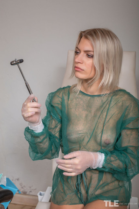 Horny young Lesya attends to her twat with dental instruments