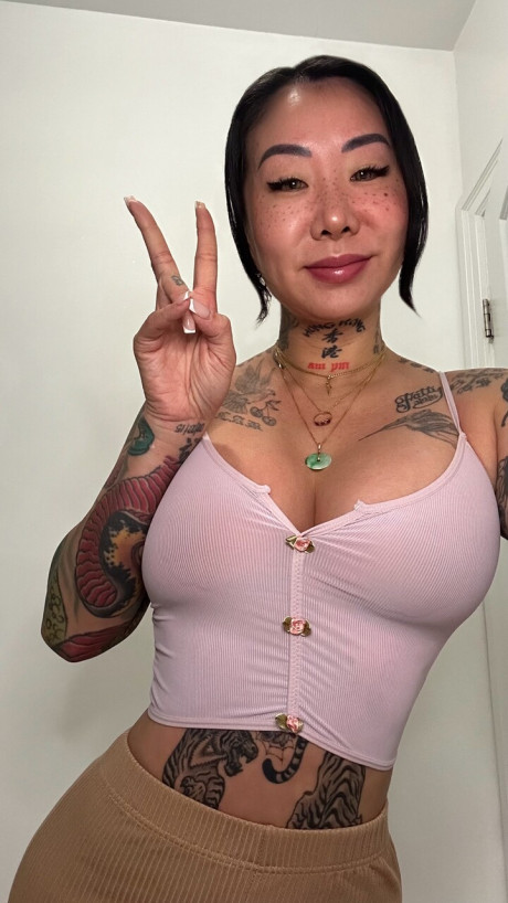 Tattooed oriental whore broad Sayless Savage takes selfies in undergarment and swimwear