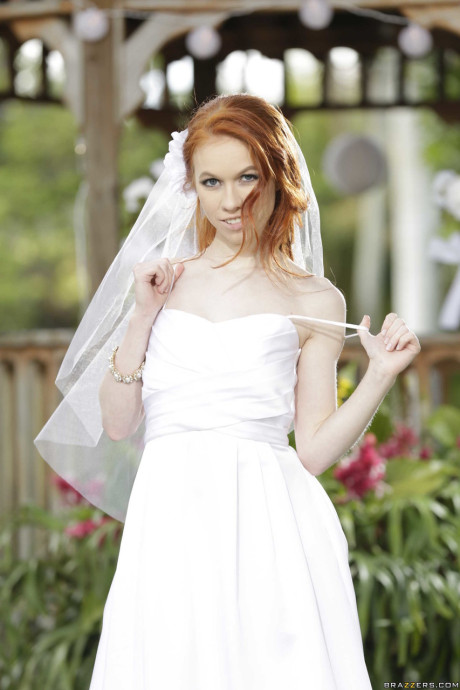 Charming bride Dolly Little strips off her hot wedding dress outdoors