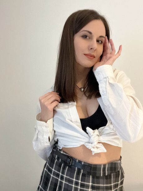 Sexy brunette young Alina Berryy teases with her cleavage and monstrous booty