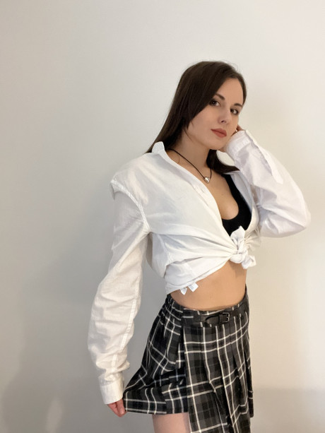 Sexy brunette young Alina Berryy teases with her cleavage and monstrous booty