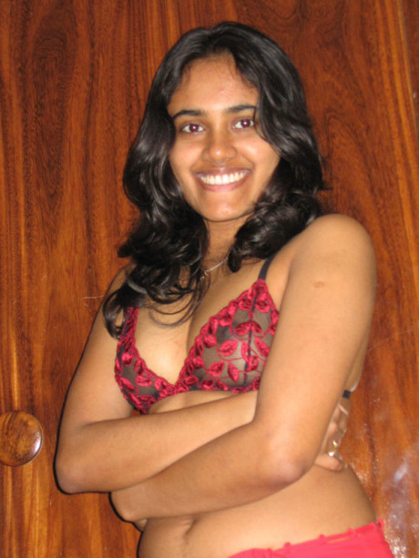 Indian lady GF lady with a nice smile shows her boobies on top of a bed