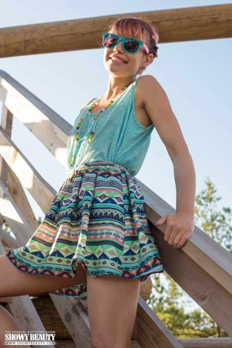 Lovely ginger head Angelina undresses for her first nudes up on a fire lookout spot