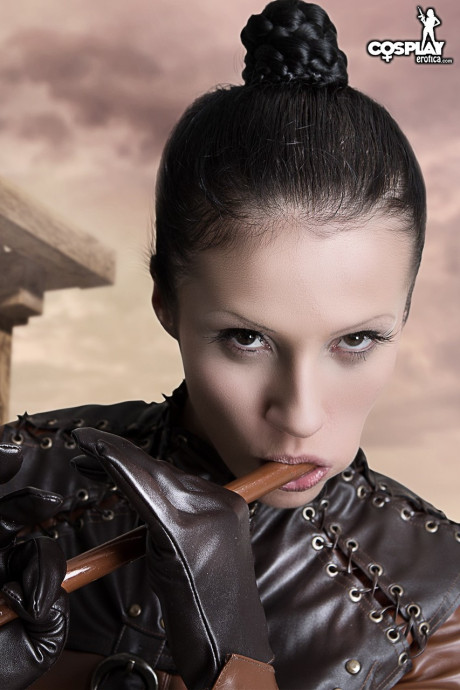 Cosplayer releases her firm boobies and vagina from leather clothing