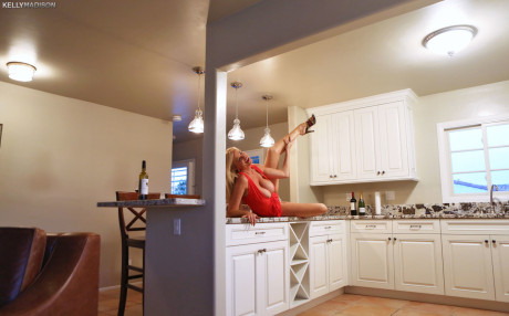 Yellow-haired old with gigantic melons Kelly Madison flashes her pussy in the galley