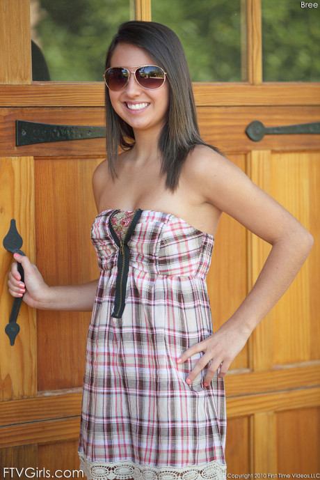 19 year older babe Bree exposes her natural tits & shaved cunt in a lovely dress