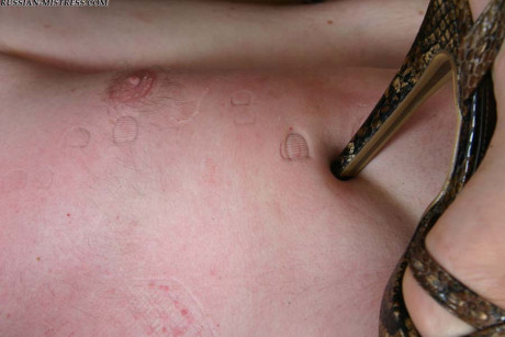Fully clothed women stomp on a shirtless hubby bf lover while wearing heels
