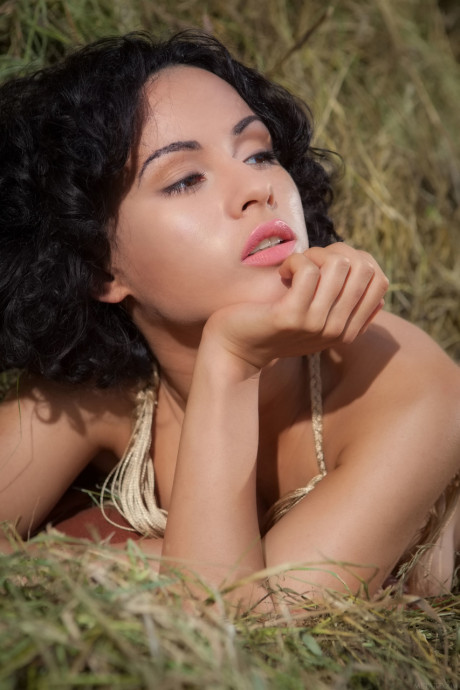 Ravishing young Pammie Lee unveils her amazing huge titties and poses in the hay
