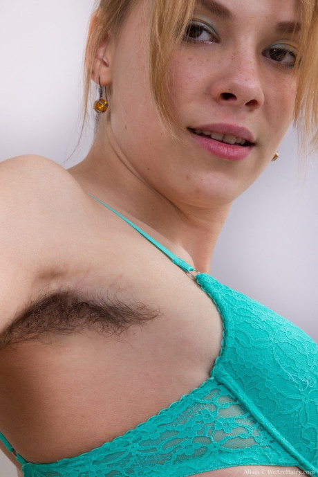 Amateur slut girl chick Alisia reveals bushy armpits and beaver while undressing