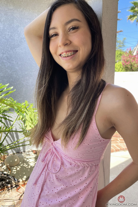 Pretty brunette Amber Angel shows her irresistible shaved vagina up close