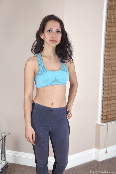 Dark-haired babe Rosa loses her sportswear and flaunts her furry vagina