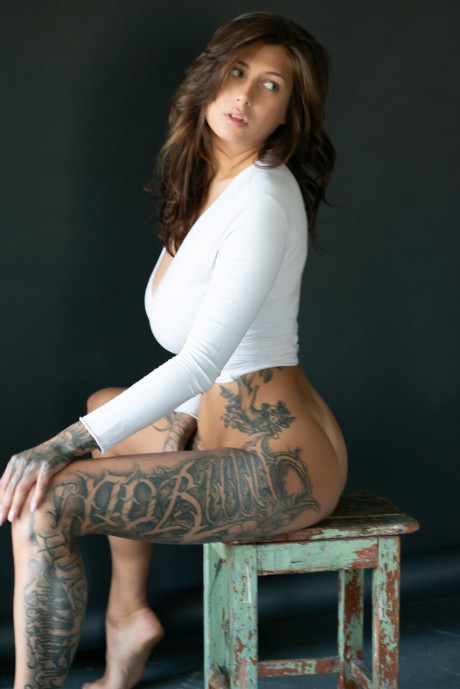 Tattooed chick lady poses in her underthings as well as undressed albeit in a SFW manner