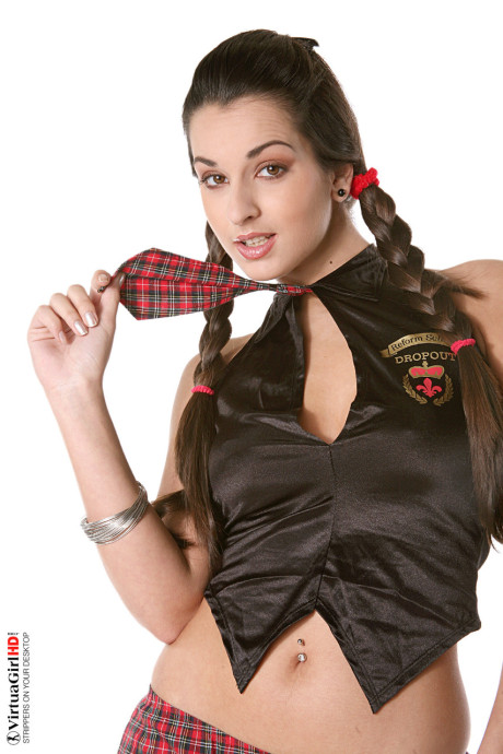 Hot brunette in braided pigtails does a sensual striptease