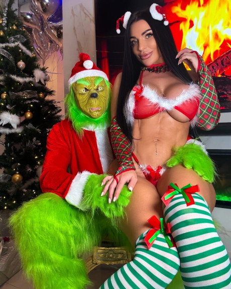 Hot MILF Nadine Kerastas teases with her giant melons in charming undies at Xmas