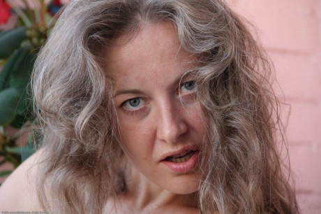 Tall Caucasian grandmother Olga pours water all over her boobs & fingers her cunt