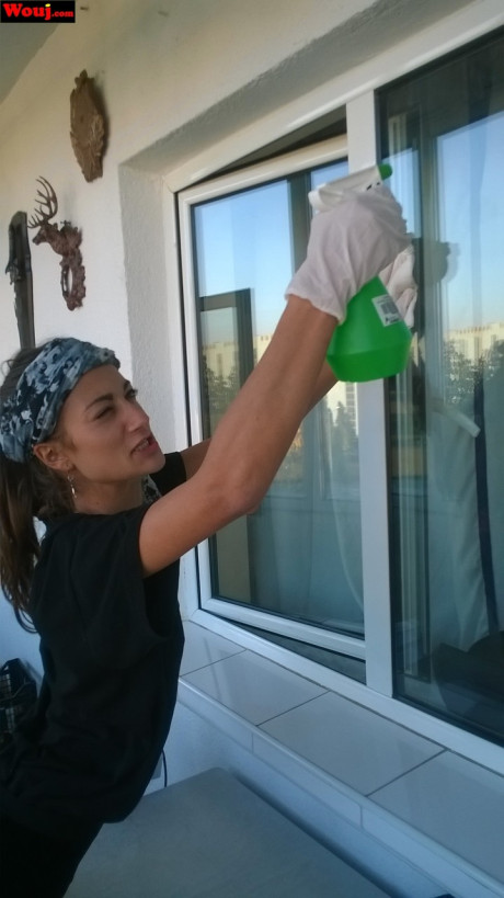 Lovely housewife WouJ flaunts her enormous ass while cleaning the windows outdoors