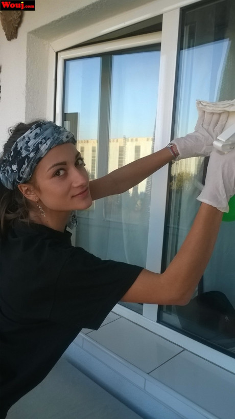 Lovely housewife WouJ flaunts her enormous ass while cleaning the windows outdoors