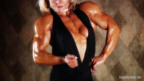 Yellow-haired Slovenian bodybuilder Brigita Brezovac shows her cleavage & hot muscles