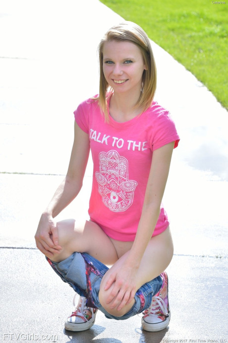 Cute petite young Catarina unveils her tiny boobies and lovely clam at the park