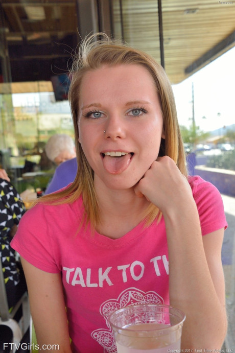 Cute petite young Catarina unveils her tiny boobies and lovely clam at the park