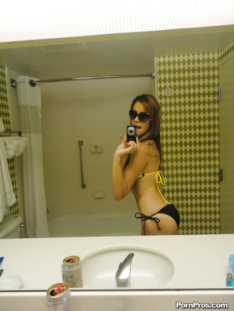 Sunglass wearing ex-gf gf Mandy Haze snapping selfies of her nice boobs in mirror