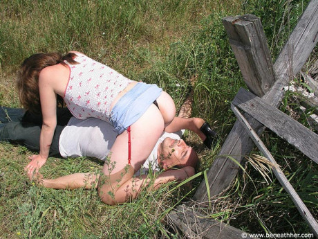 Caucasian chick straddles her submissive fiance BF man face outside in long grass