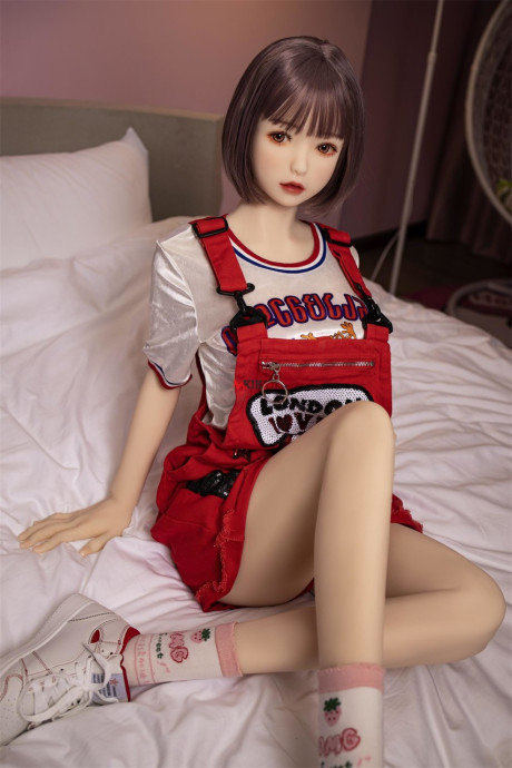 Brunette gamer sex doll Kumi poses undressed and touches her fuckable cunt