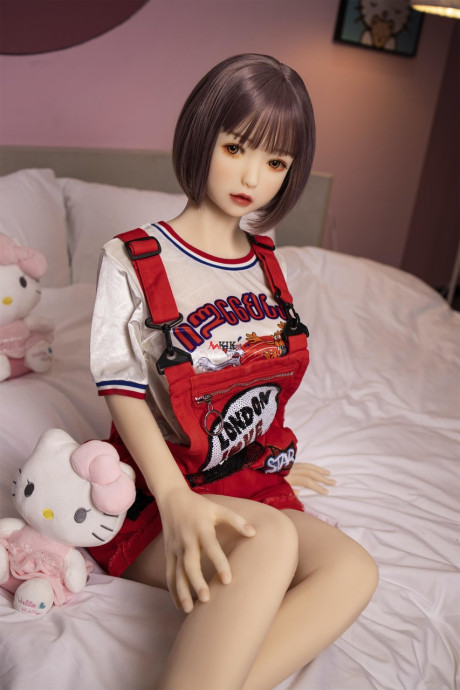 Brunette gamer sex doll Kumi poses undressed and touches her fuckable cunt