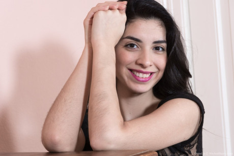 Dark haired bushy Ornella bends over to flaunt her super silky twat