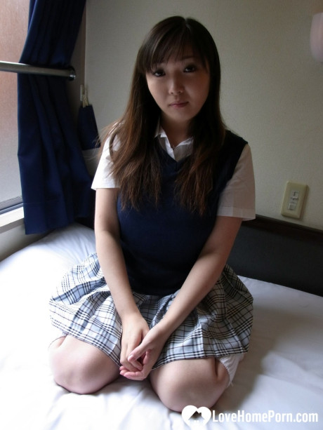 Lovely asian brunette babe unveiling her incredible humongous titties in a solo