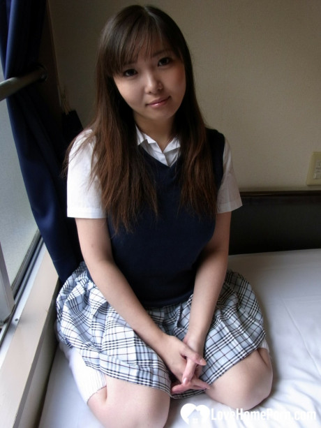 Lovely asian brunette babe unveiling her incredible humongous titties in a solo